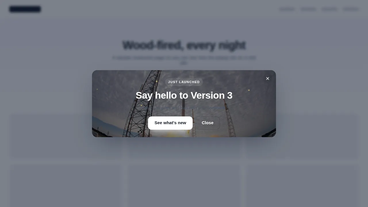 Product launch popup centred over a sample website, with headline, short pitch and a call-to-action button